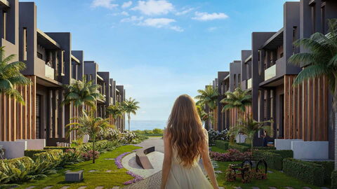Sky Diora — Villalar arasındaki peyzajlı yolda yürüyen kadın, ufukta deniz görselleştirmesi