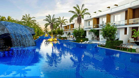 Four Seasons 3 — Die Visualisierung der Lagunenpools und des Felsenwasserfalls sowie der zweistöckigen Wohnhäuser mit Blick auf den Pool