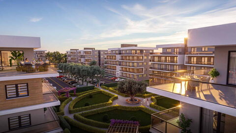 Olea Residence — Balkondan site içi: çiçekli pergolalar, bahçe ve gün batımında apartman blokları görselleştirmesi
