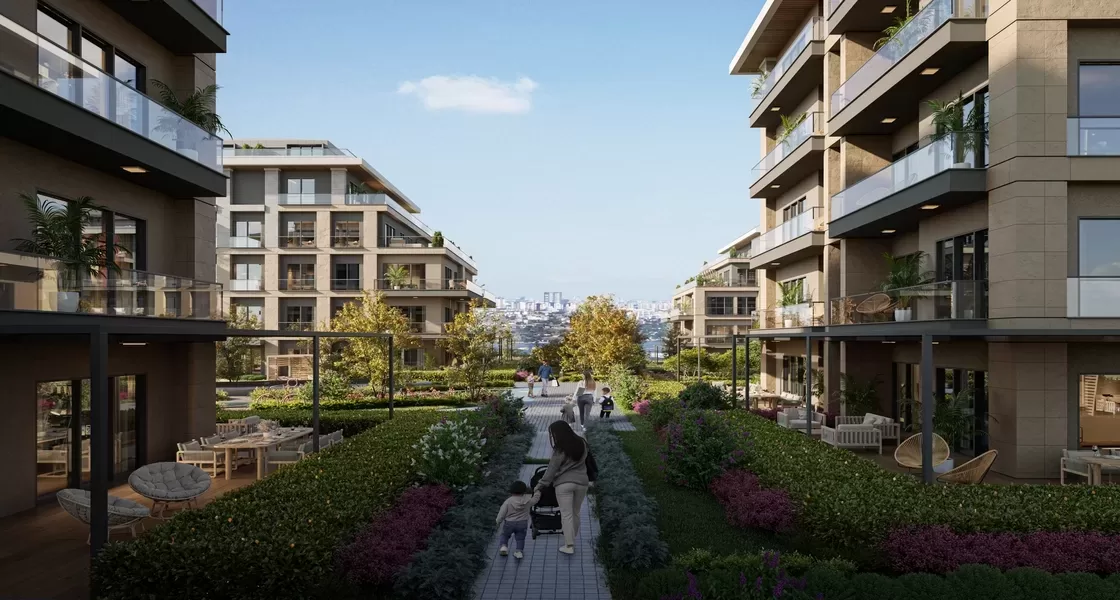 Bloklar arasındaki peyzajlı yürüyüş yolu; çiçek tarhları ve oturma birimleri